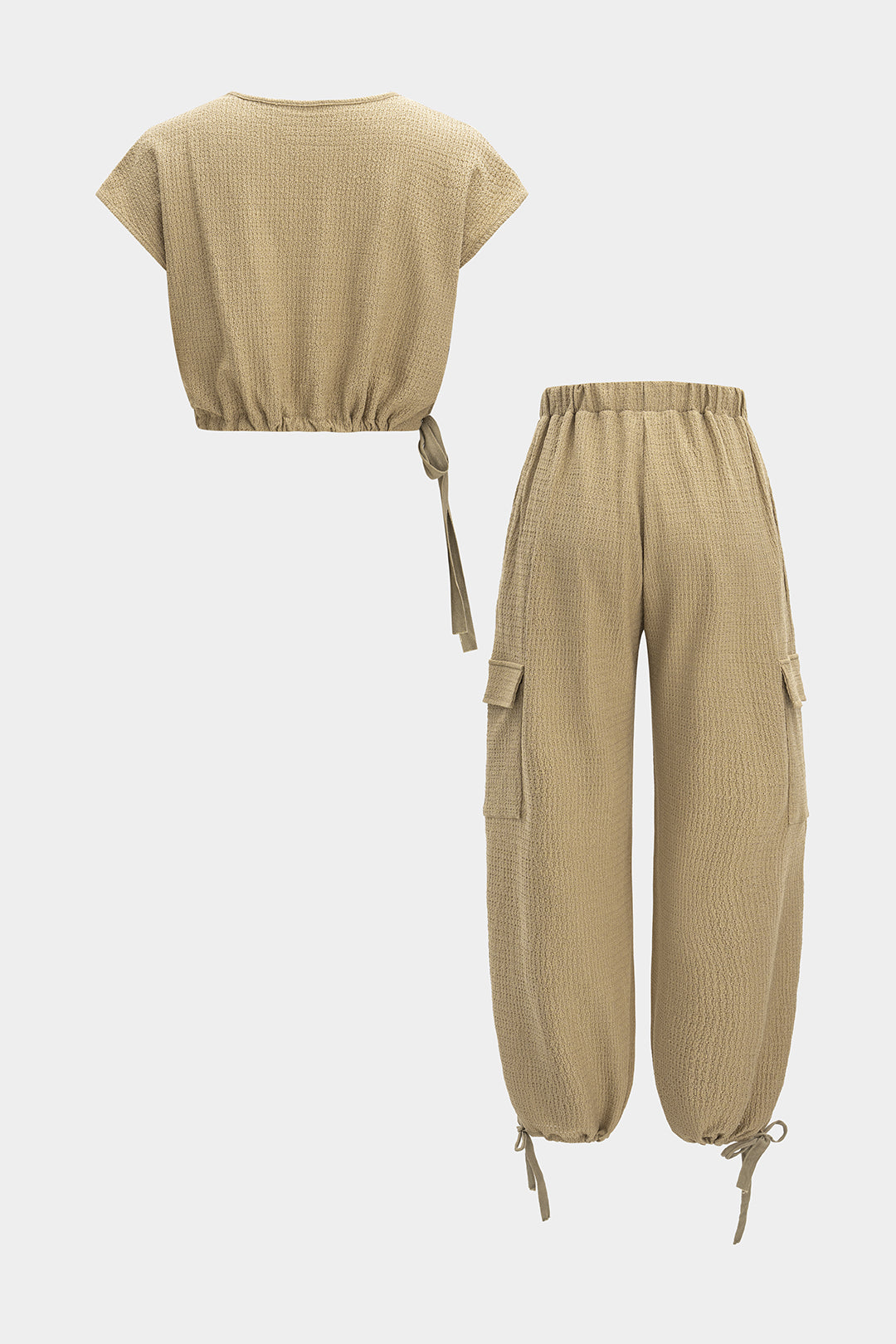 Set of a V-neckline blouse with straps and trousers with pockets