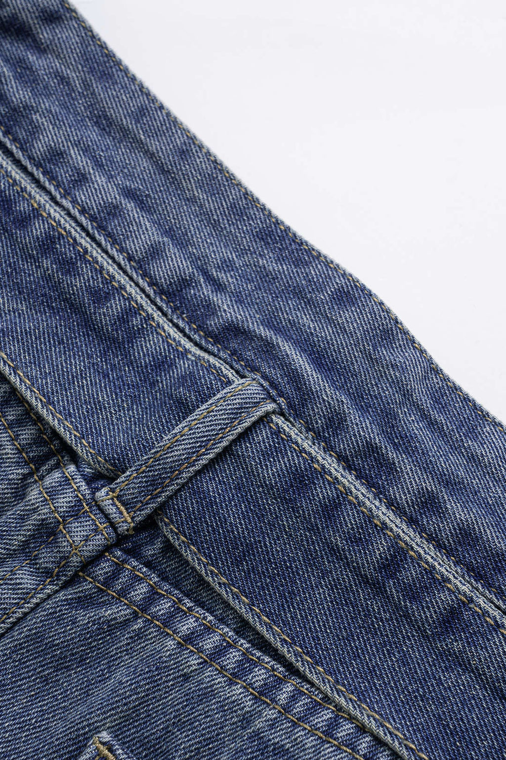 Asymmetric denim shorts with pockets