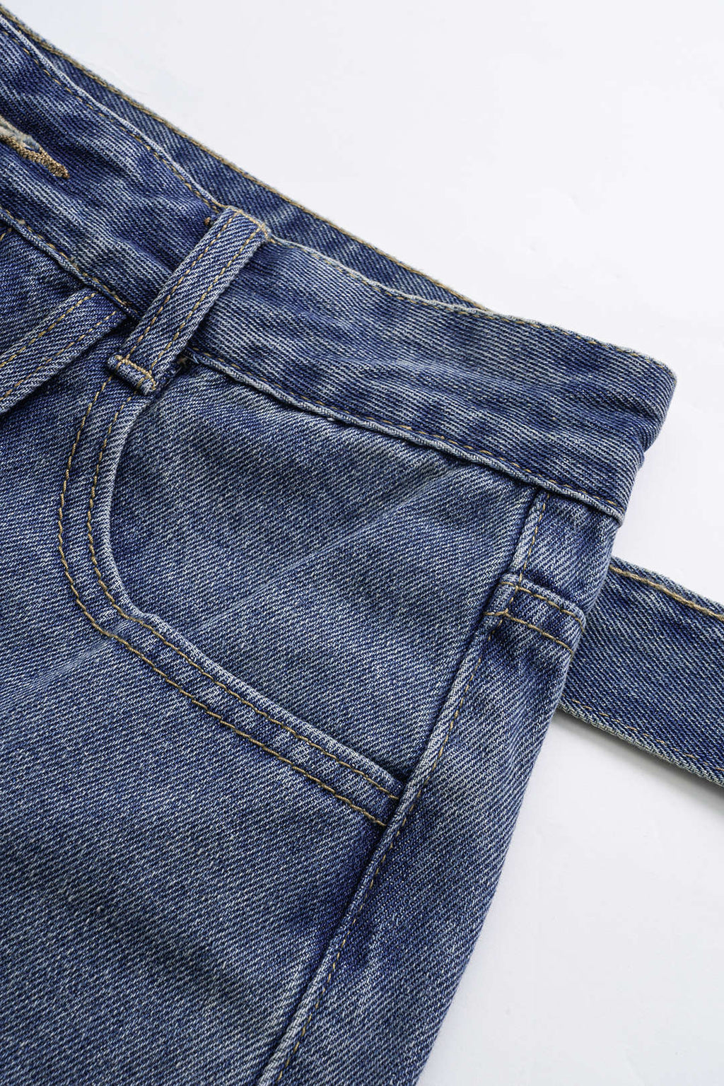 Asymmetric denim shorts with pockets